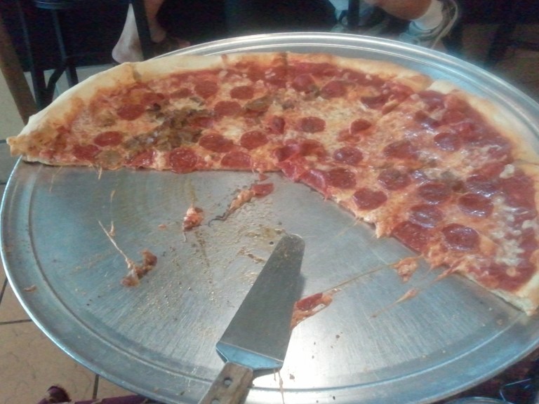 A giant pizza from A NY Pizza House in Cocoa Beach Florida