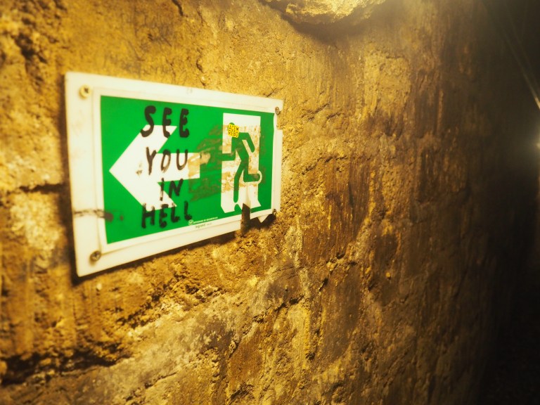 see you in hell sign graffiti in Paris catacombs 
