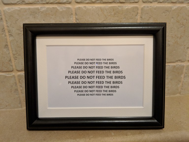 don't feed the birds sign ladies room dubrovnik city walls croatia